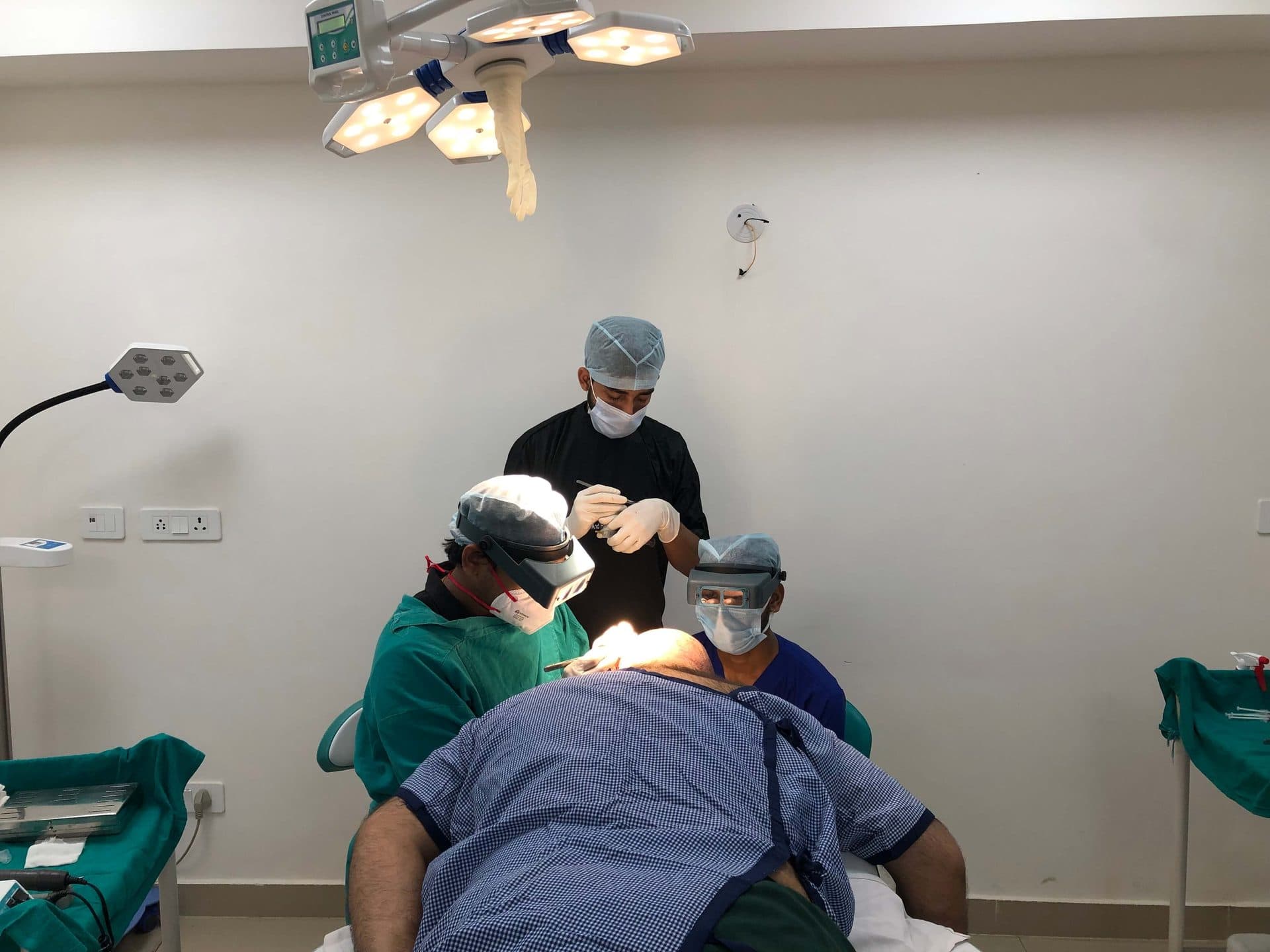 Dr. Pratap and the surgical team performing a hair transplant procedure